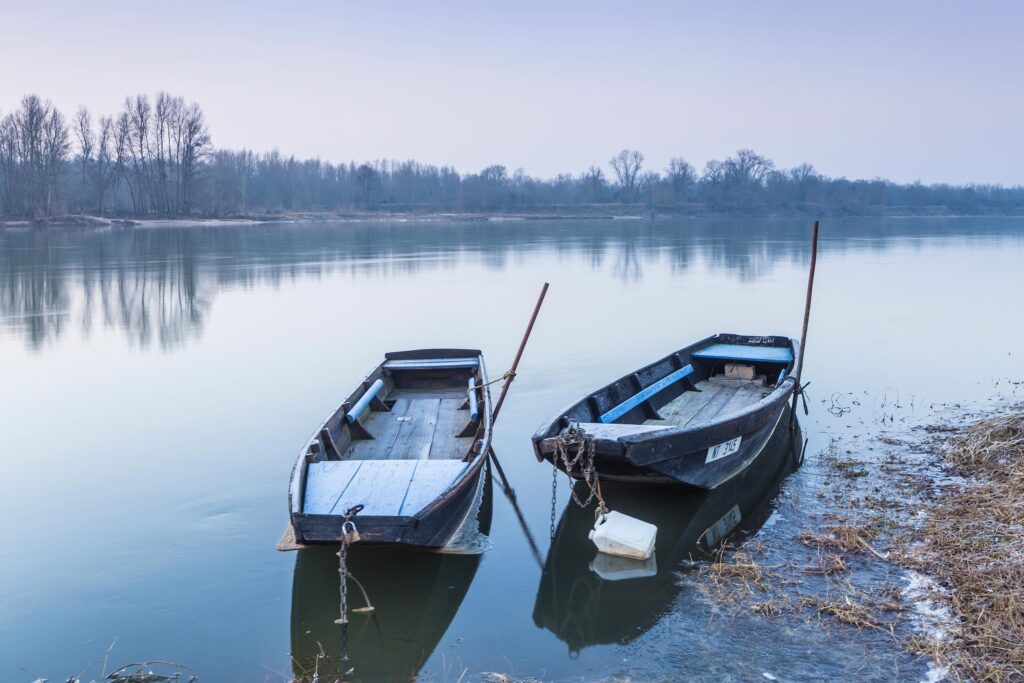 Wooden boats on the edge of the Loire River, France.