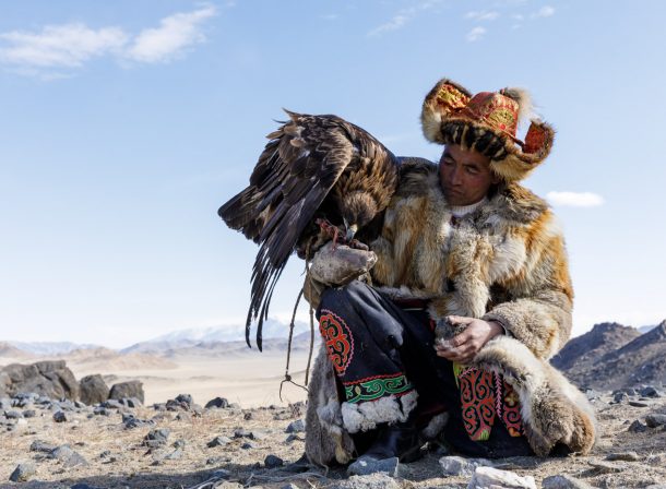 A Kazak Mongolian eagle hunter and his eagle