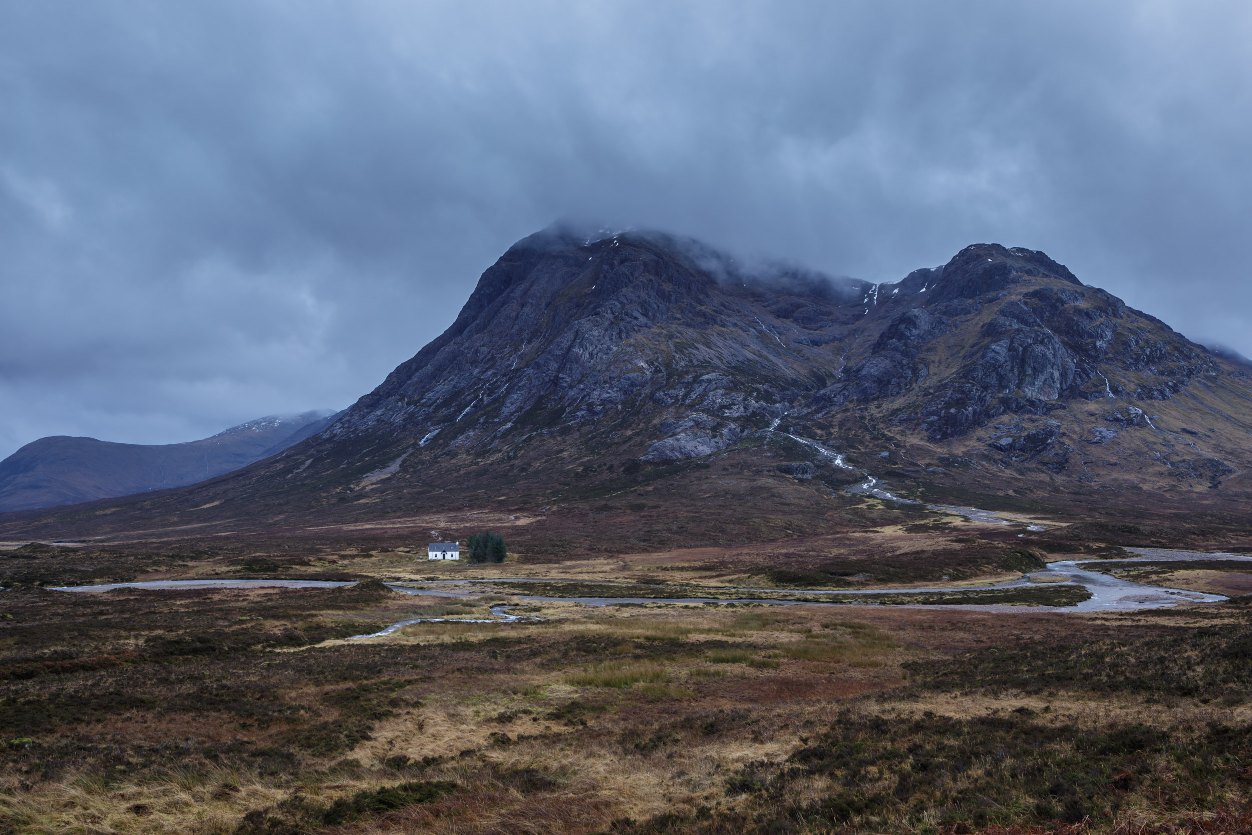 Buachaille Etive Mor and Lagangarbh Cottage on Rannoch Moor in the Scottish Highlands, UK.