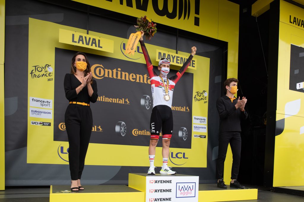 Tadei Pogacar on the podium of the stage 5 time trial of the Tour de France 2021 cycle race in Laval, France.