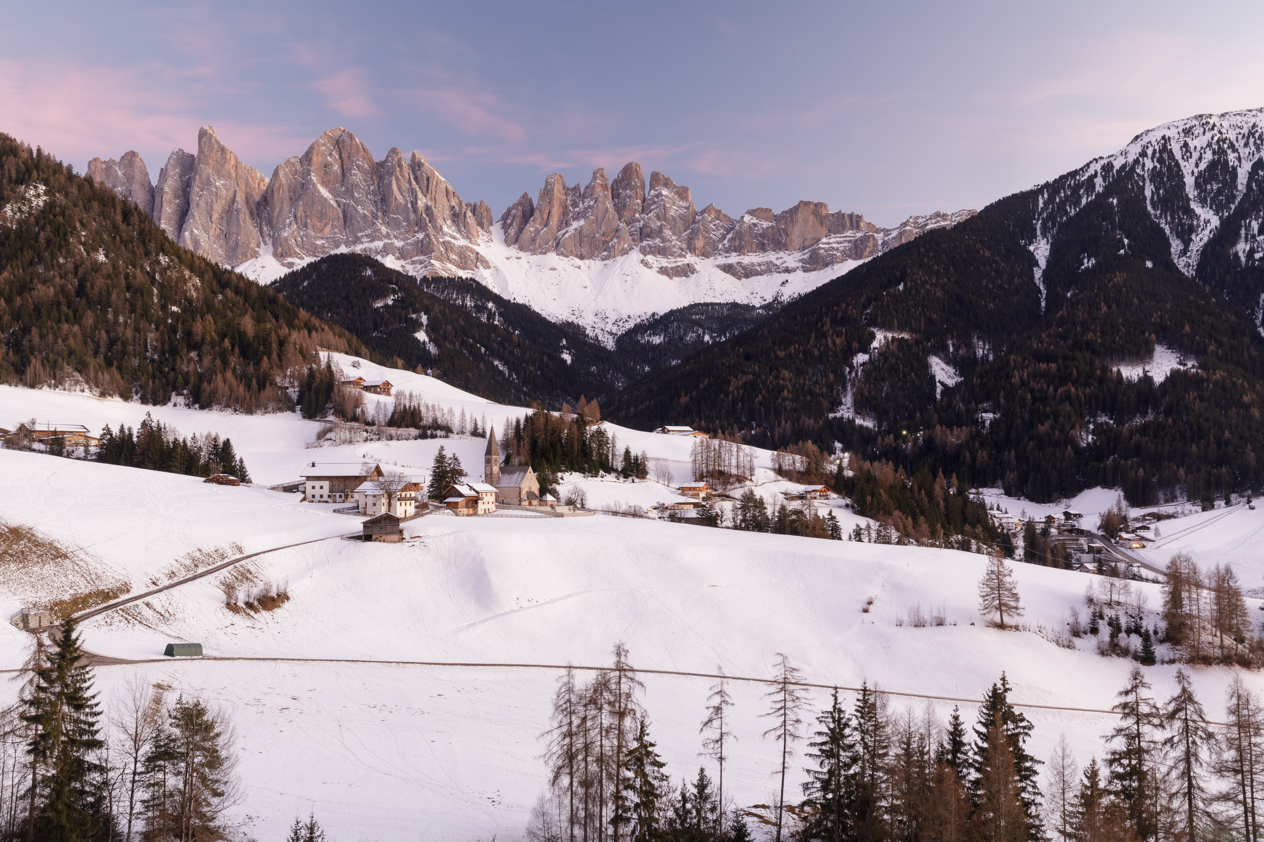 Beautiful winter conditions in front of Chiesa di Santa Maddalena church backed by the Odle range in the Val di Funes, Dolomites, Italy.