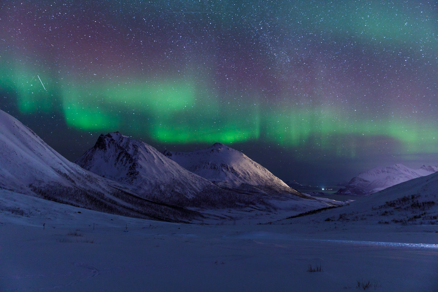 Snow covered mountains around the coastline near to Tromso