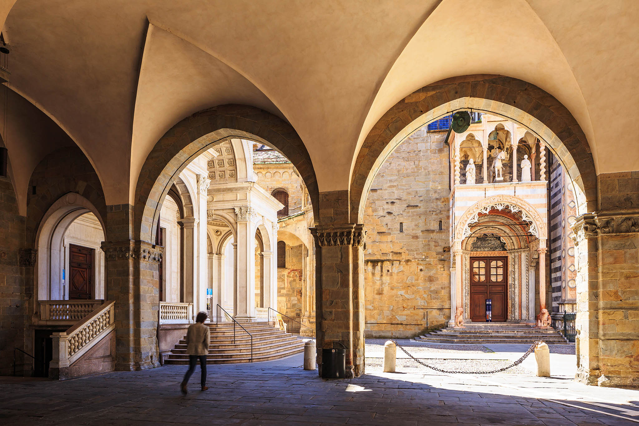 Piazza Vecchia in Bergamo Alta, Italy. A hilltop medieval town, Bergamo Alta is known for its beautiful historic centre. Piazz Vecchia plays host to both Basilica Santa Maria Maggiore and the Duomo di Bergamo or Bergamo cathedral.