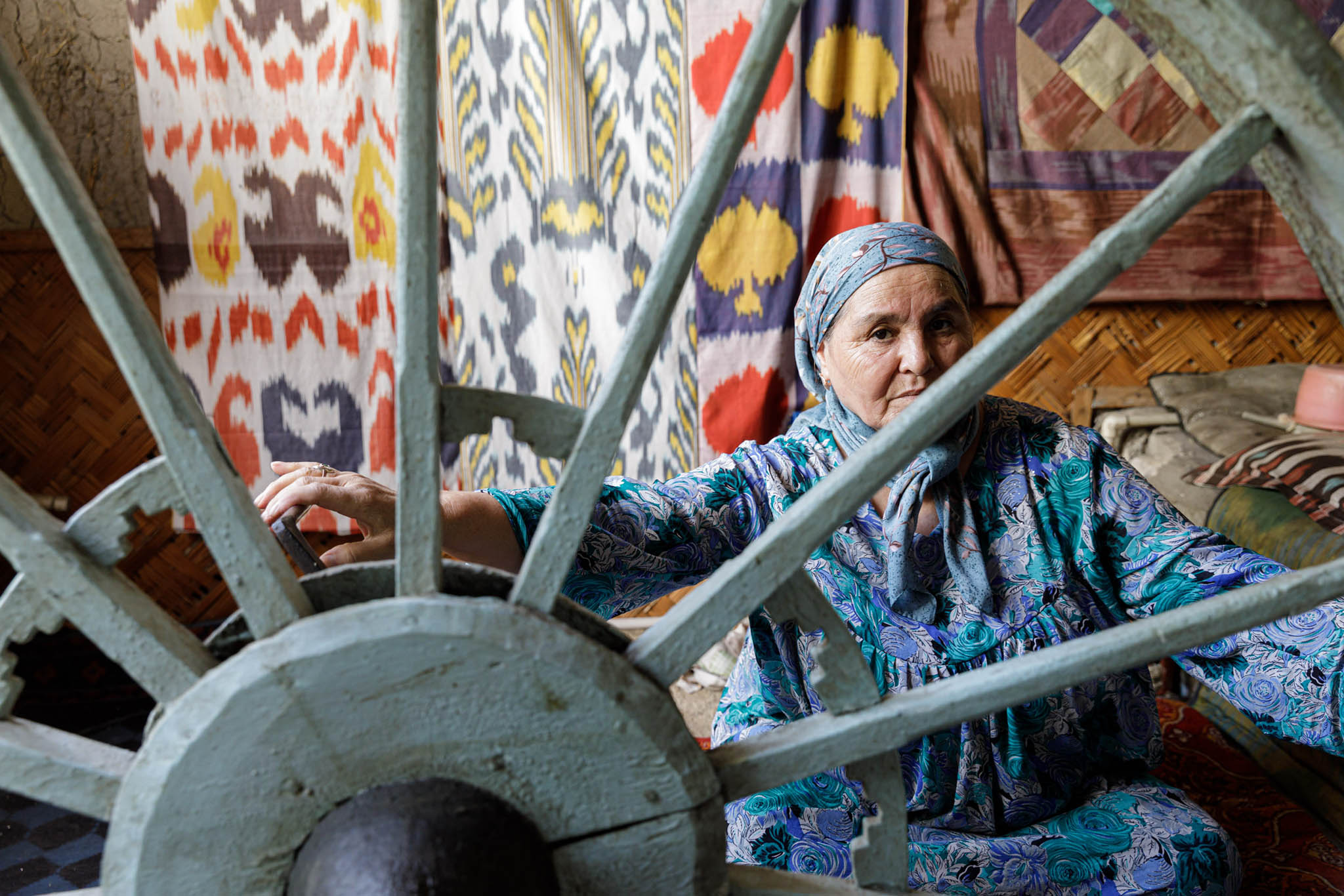 A woman weaves silk in the Ferghana Valley, Uzbekistan