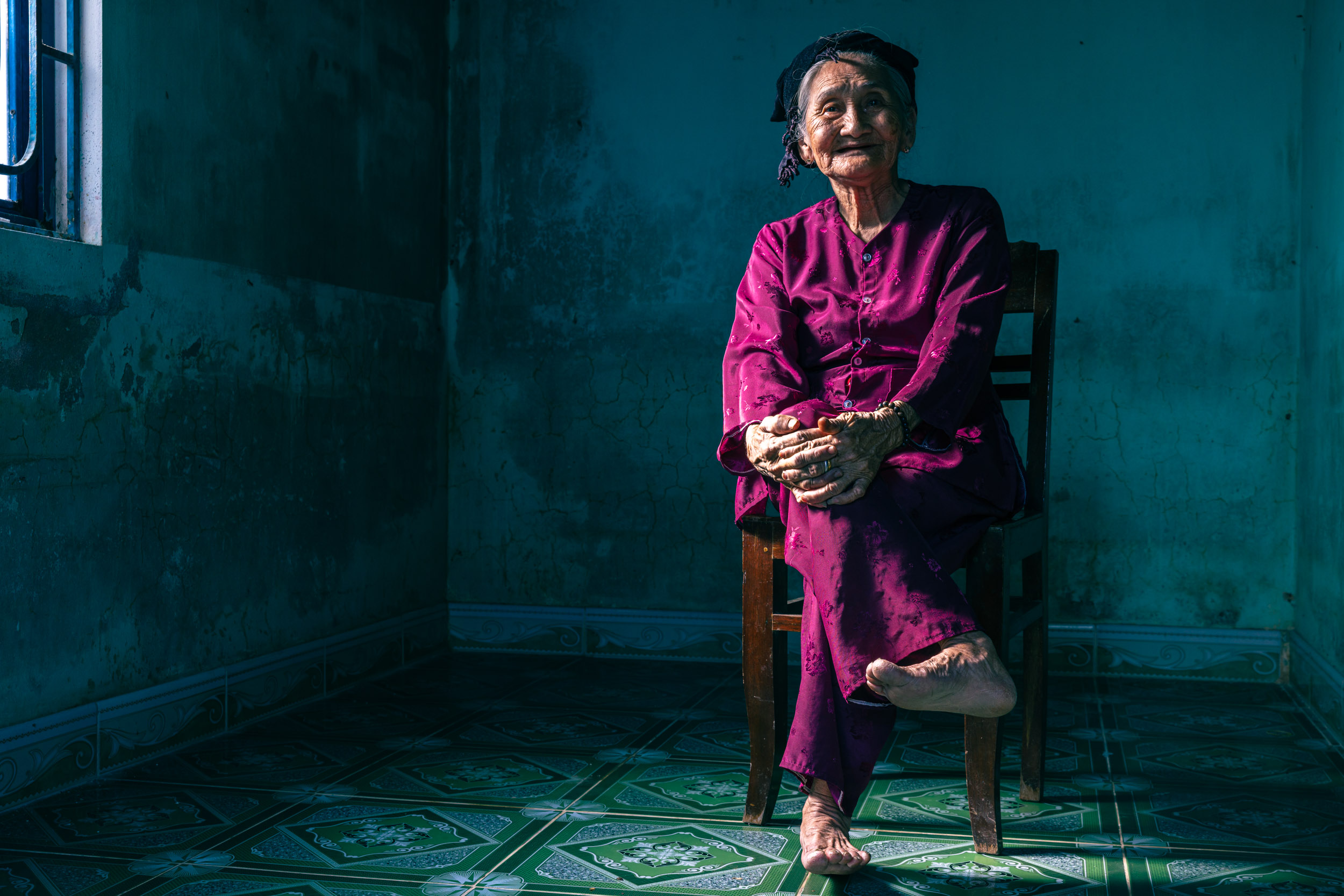Portrait of Mrs Song. A resident of Hoi An in central Vietnam. She is famous for a picture entitled hidden smile.