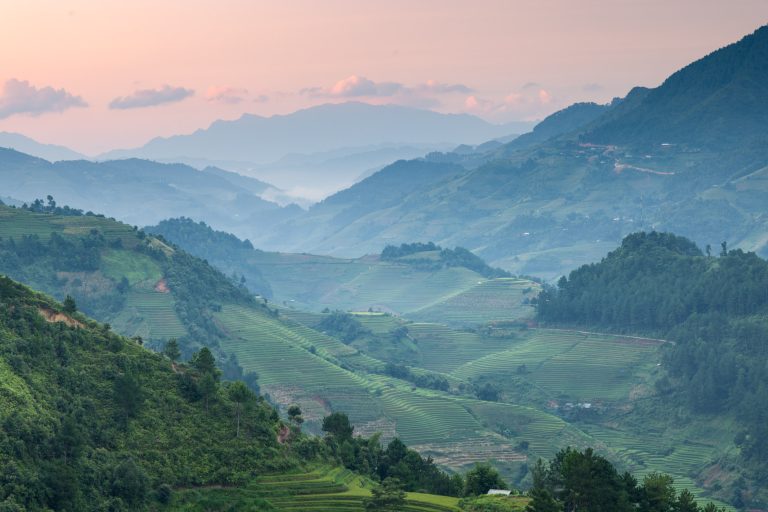 Sunrise light hits the stunning rice terraces of Mu Cang Chai