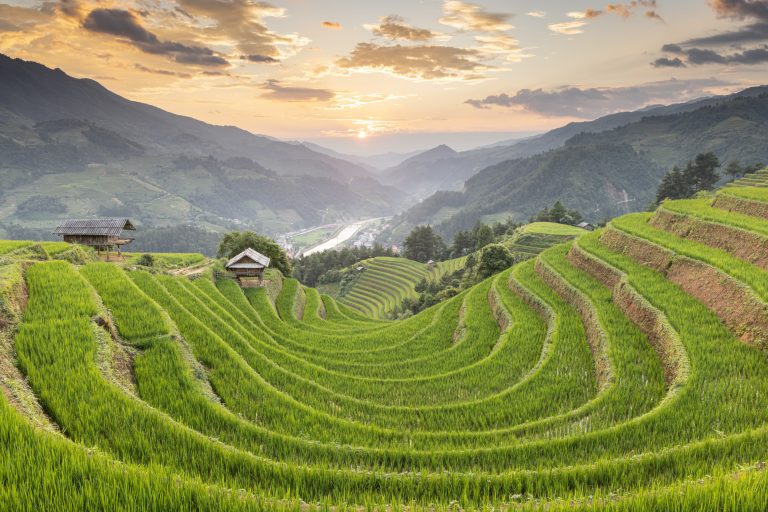 Sunset light hits the stunning rice terraces of Mu Cang Chai