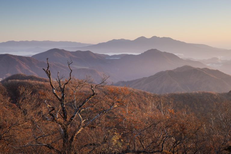 A beautiful sunrise over the mountainous landscape of Nikko national park in Japan.