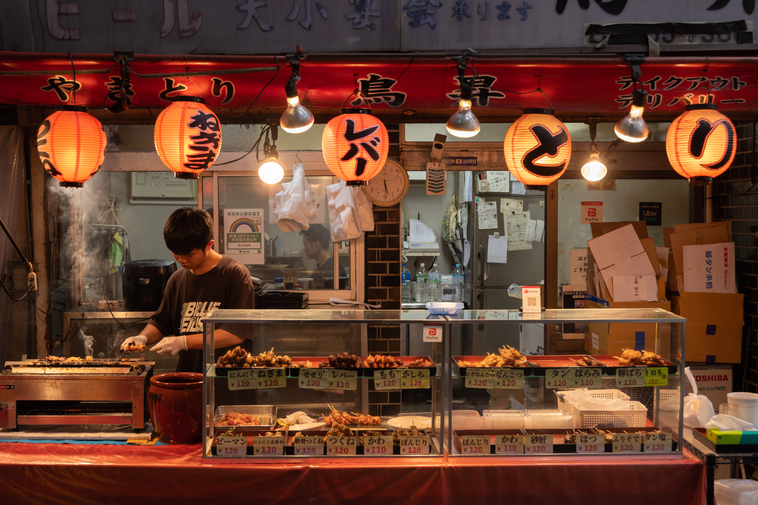 A worker at a Japanese take away restaurant in Tokyo, Japan.