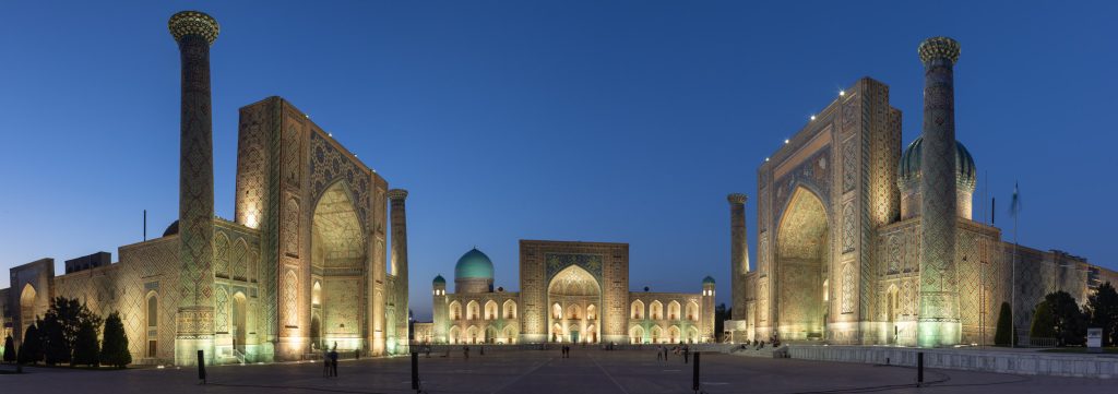 Panorama of the stunning Registan Square at night in Samarkand, Uzbekistan.