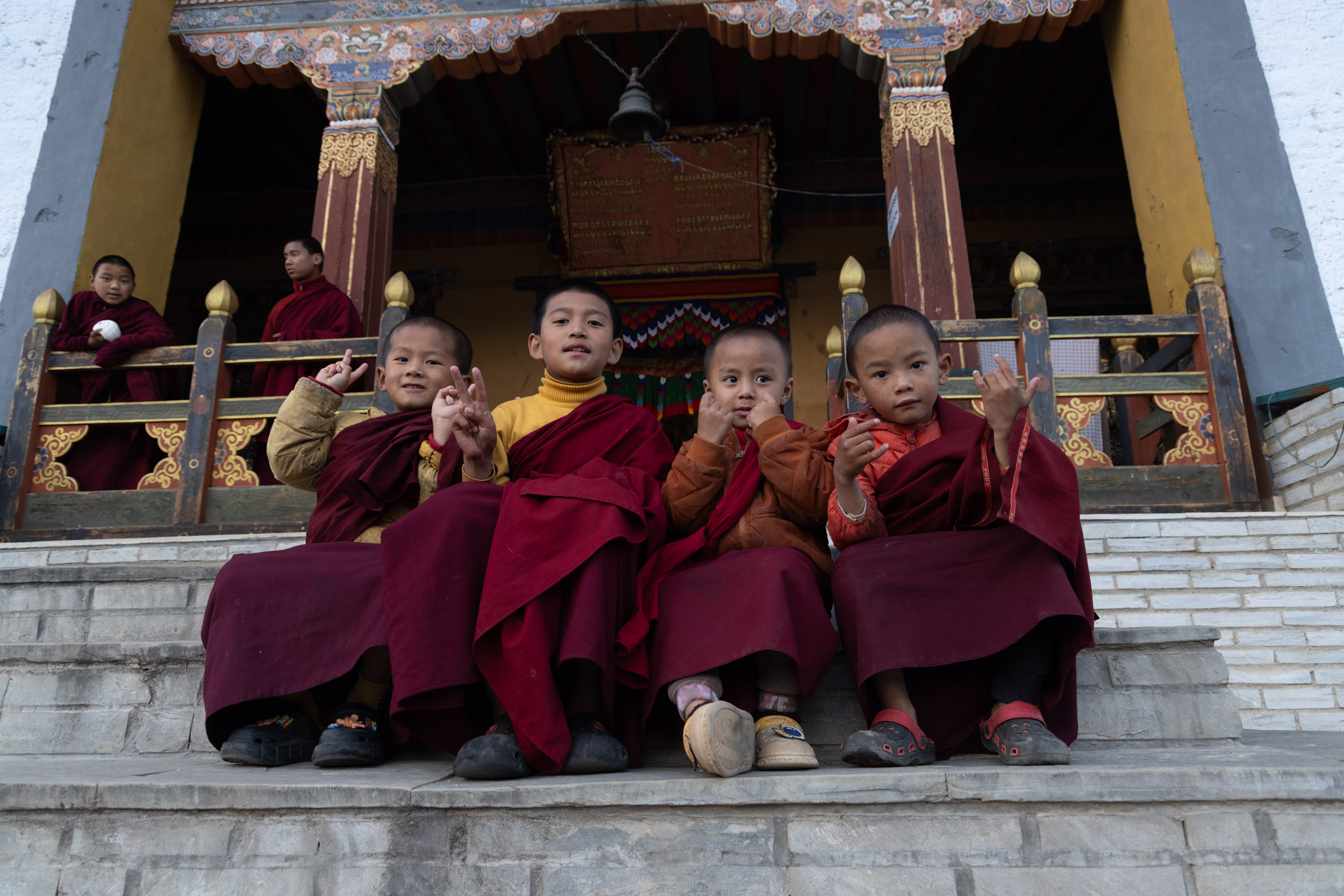 Young apprentice monks pose for their portrait at Kharchu Dratshang monastery in Jakar, Bhutan.