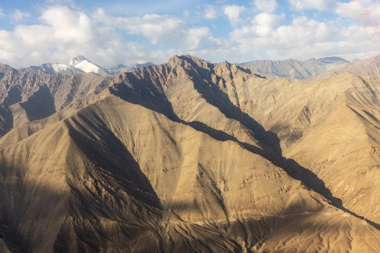 Aerial high-angle view of the mountains surround Leh in Ladakh, India.