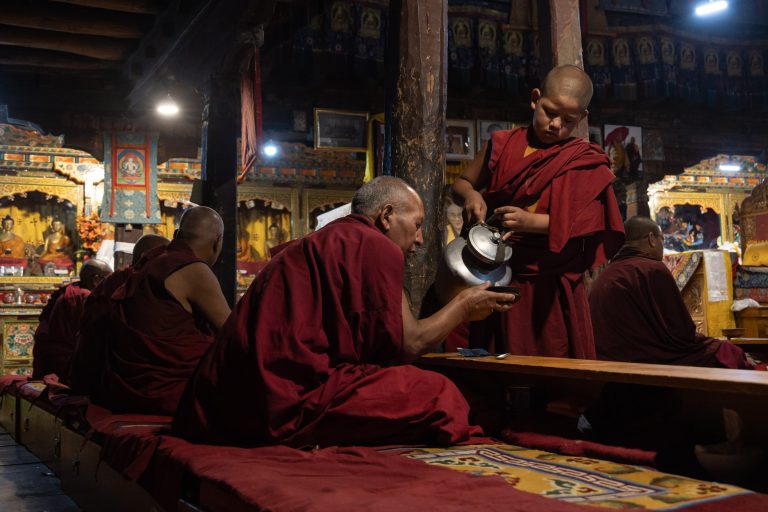 Buddhist monks at the morning Puja in Thiksey Monastery, Ladakh.