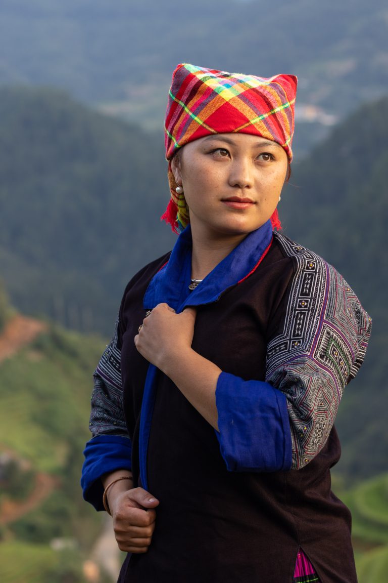 A beautiful young Hmong woman poses for her portrait in Mu Cang Chai, Vietnam.