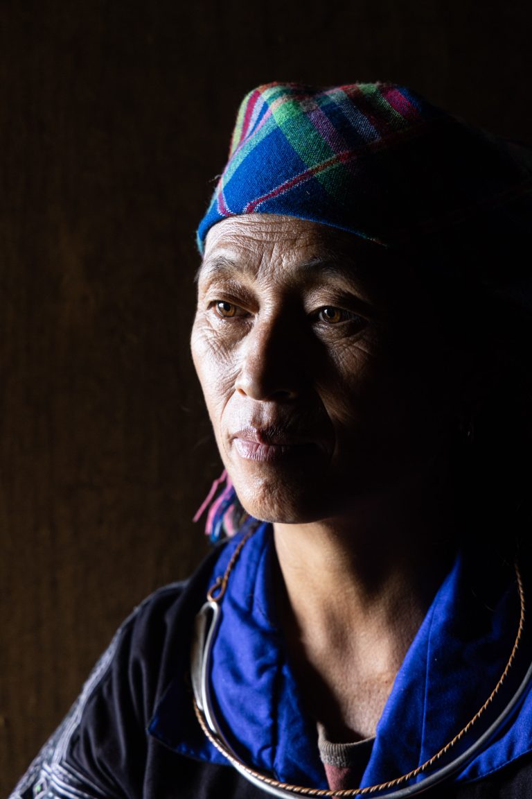 A Hmong woman inside a house in Mu Cang Chai, Vietnam.