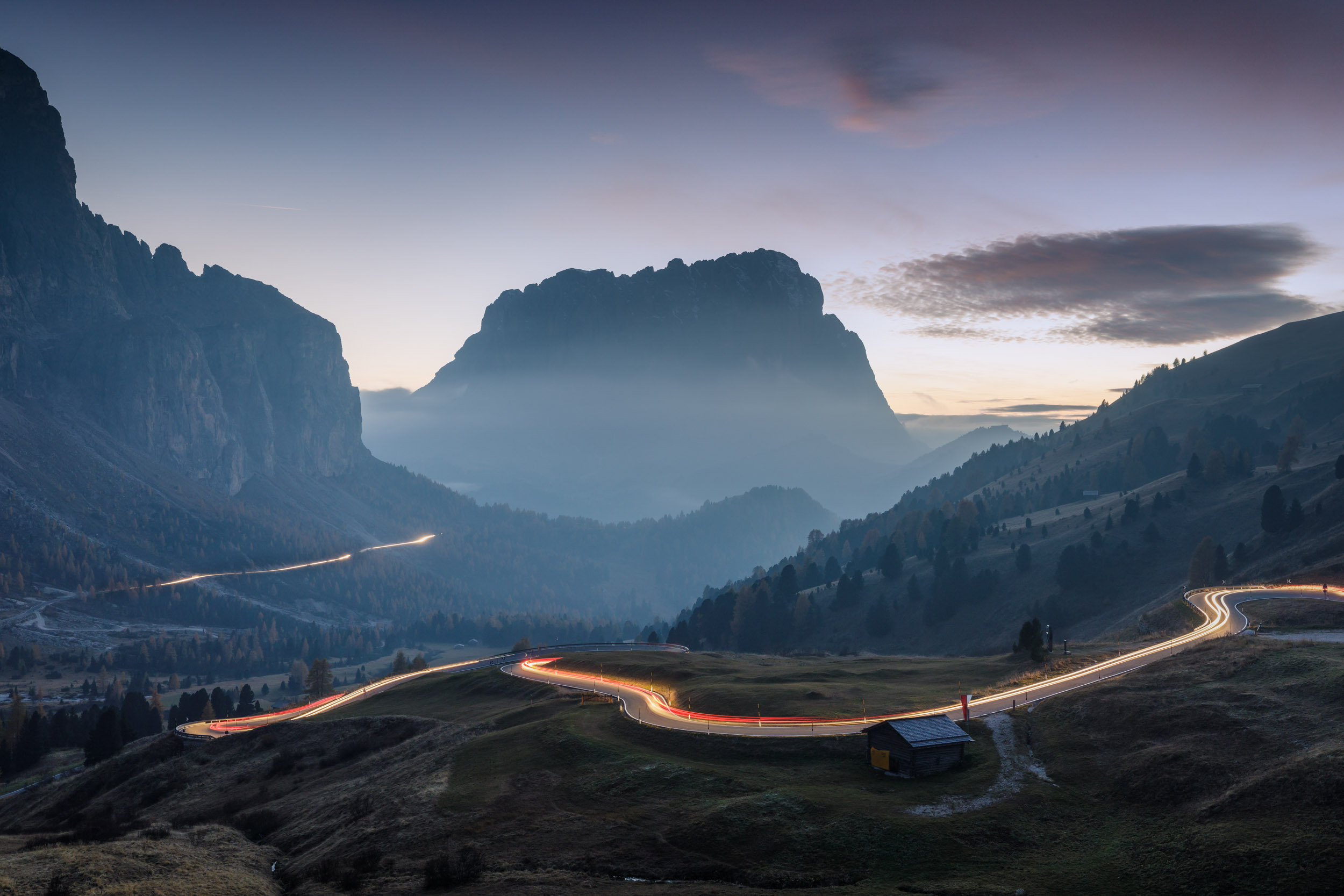 Traffic trails from cars speeding down Passo Gardena. January 2023 newsletter cover.