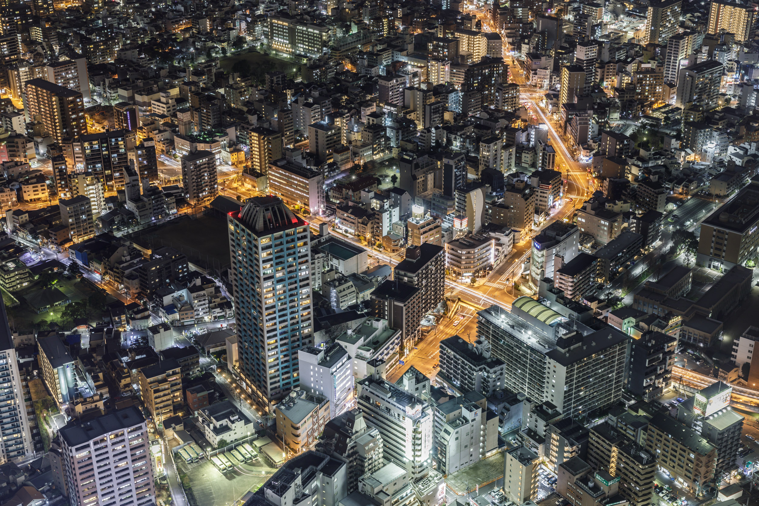 Modern high rise buildings in Osaka at night, Japan. May 2019 newsletter cover.