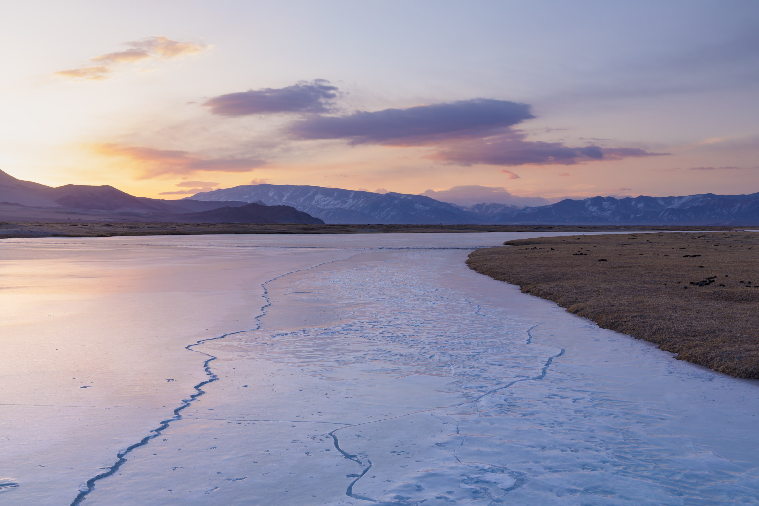 A frozen river in the vast landscapes of the Altai near to Bayan Olgii in Western Mongolia.