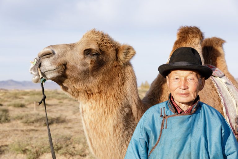 A camel trader in Mongolia. October 2018 newsletter cover.
