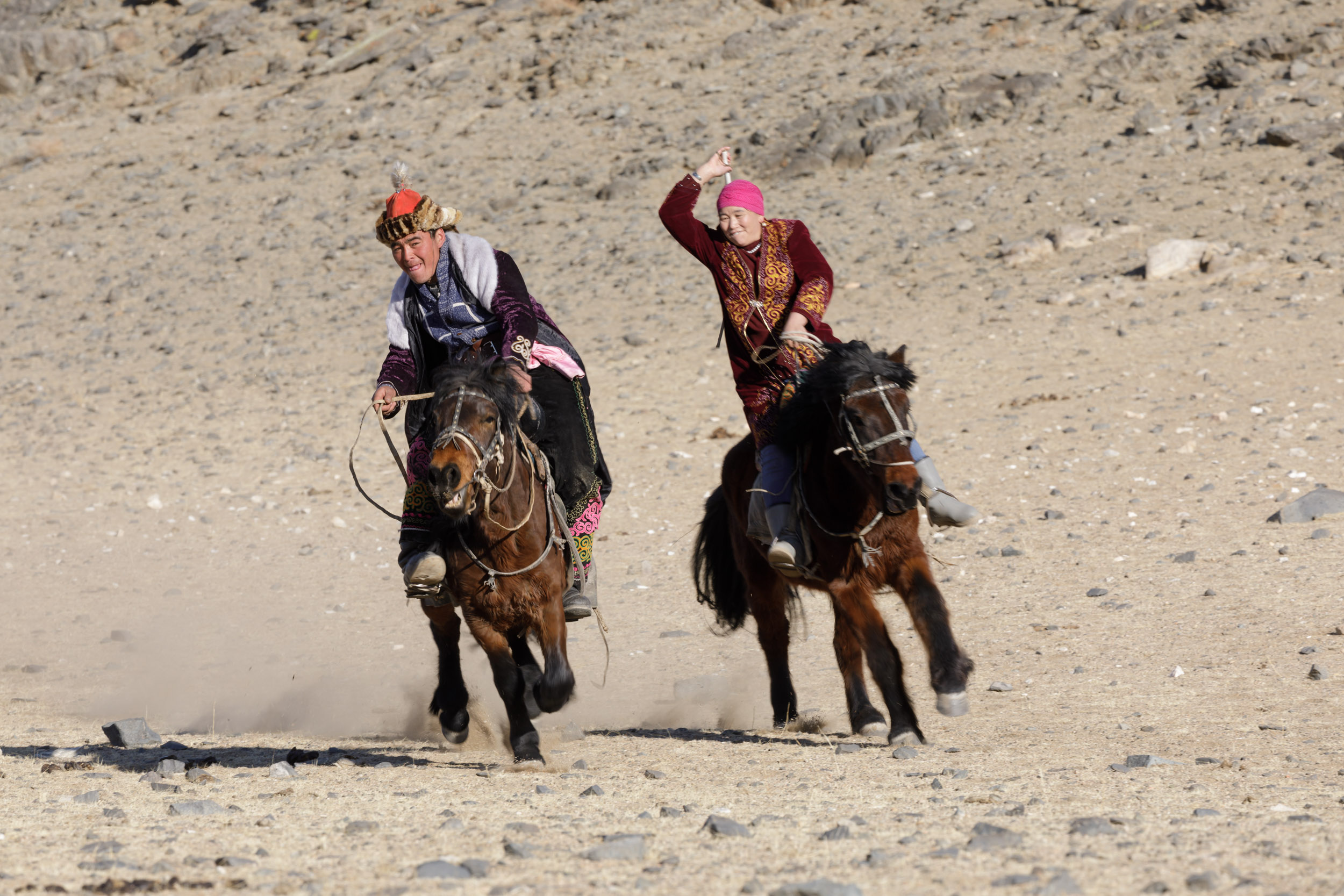 A Kazak Mongolian man and woman play the game of Kyz Kuumay.