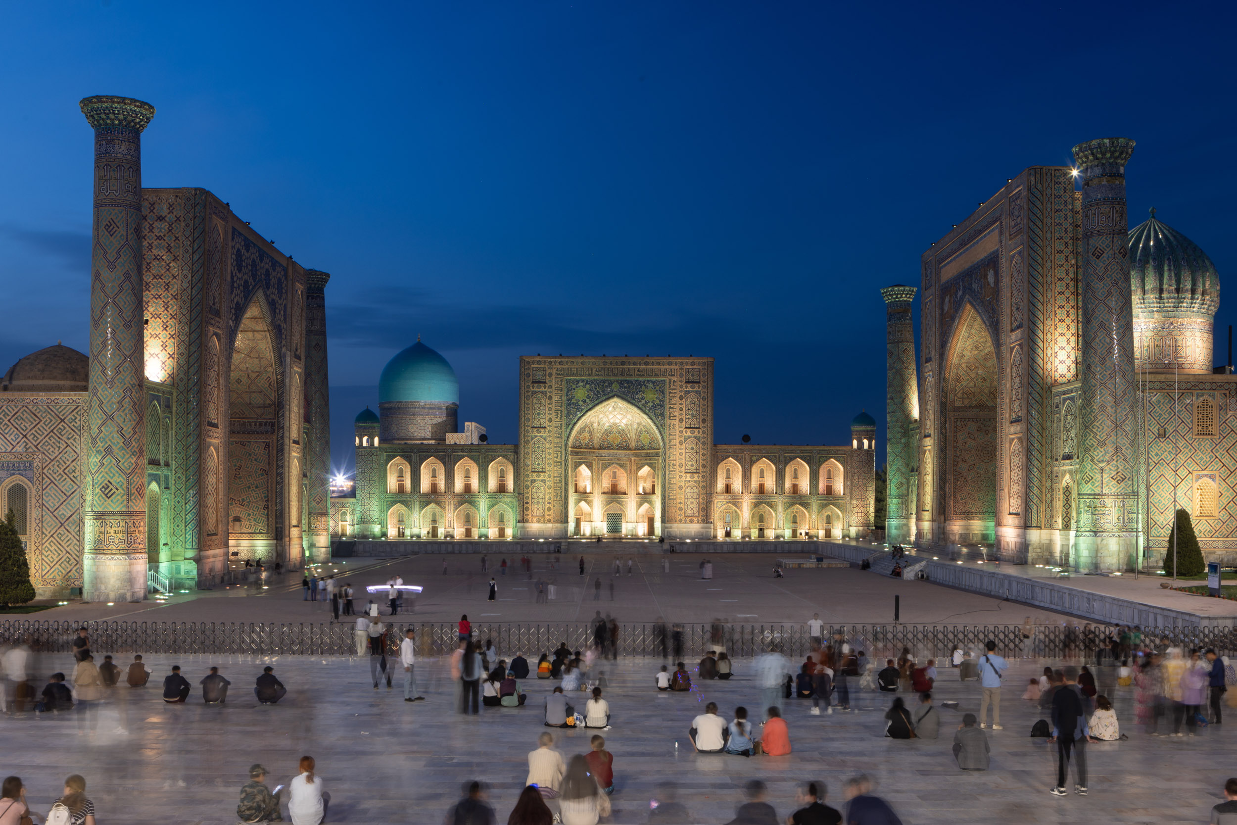 The stunning Registan Square lit up at night in Samarkand, Uzbekistan. Comprised of three madrasa, Registan Square is often regarded as one of the most beautiful squares in the world. It has UNESCO World Heritage Site status and is a part of the world-famous Silk Road.