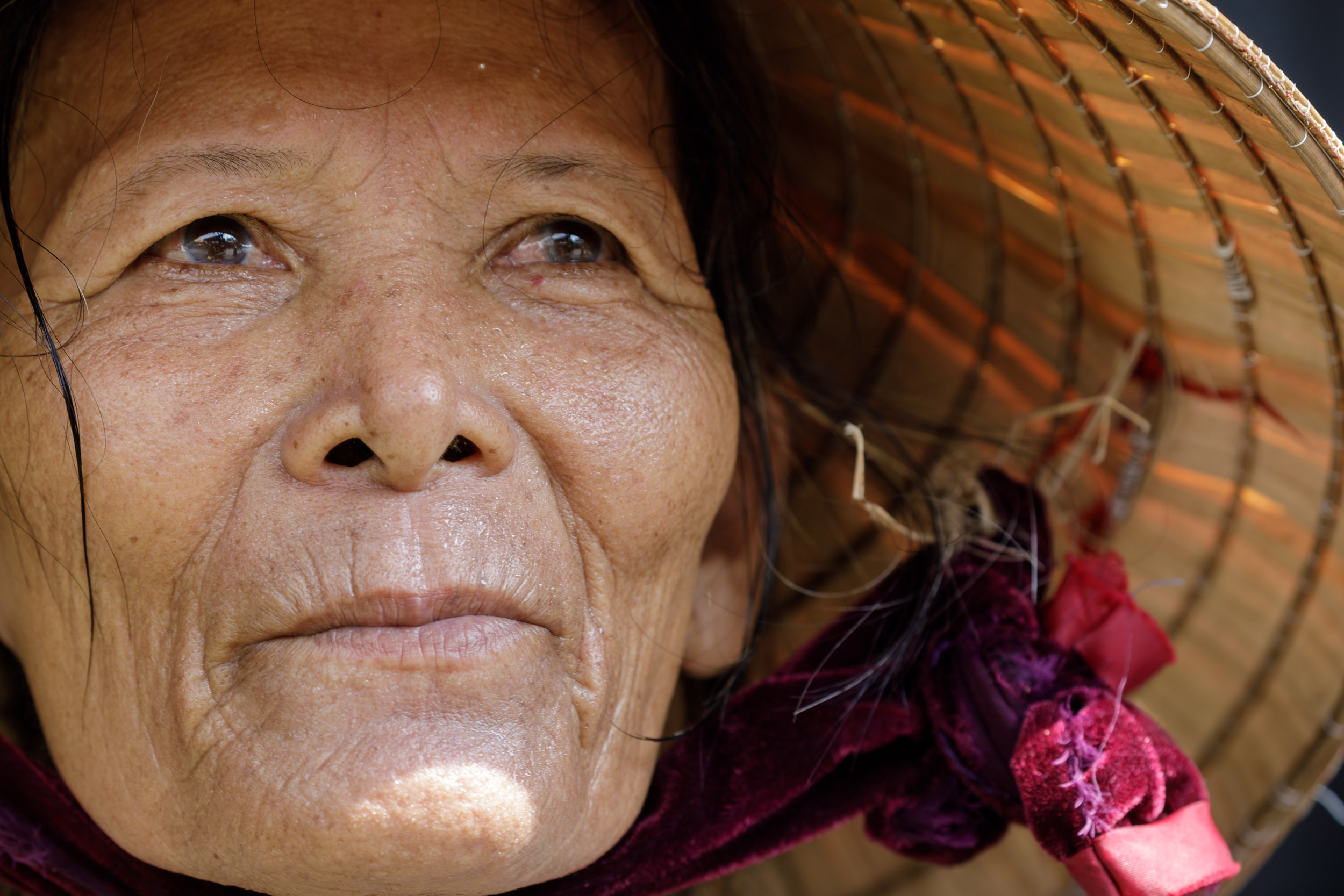 An elderly Vietnamese woman in the central market of Hoi An, Vietnam.