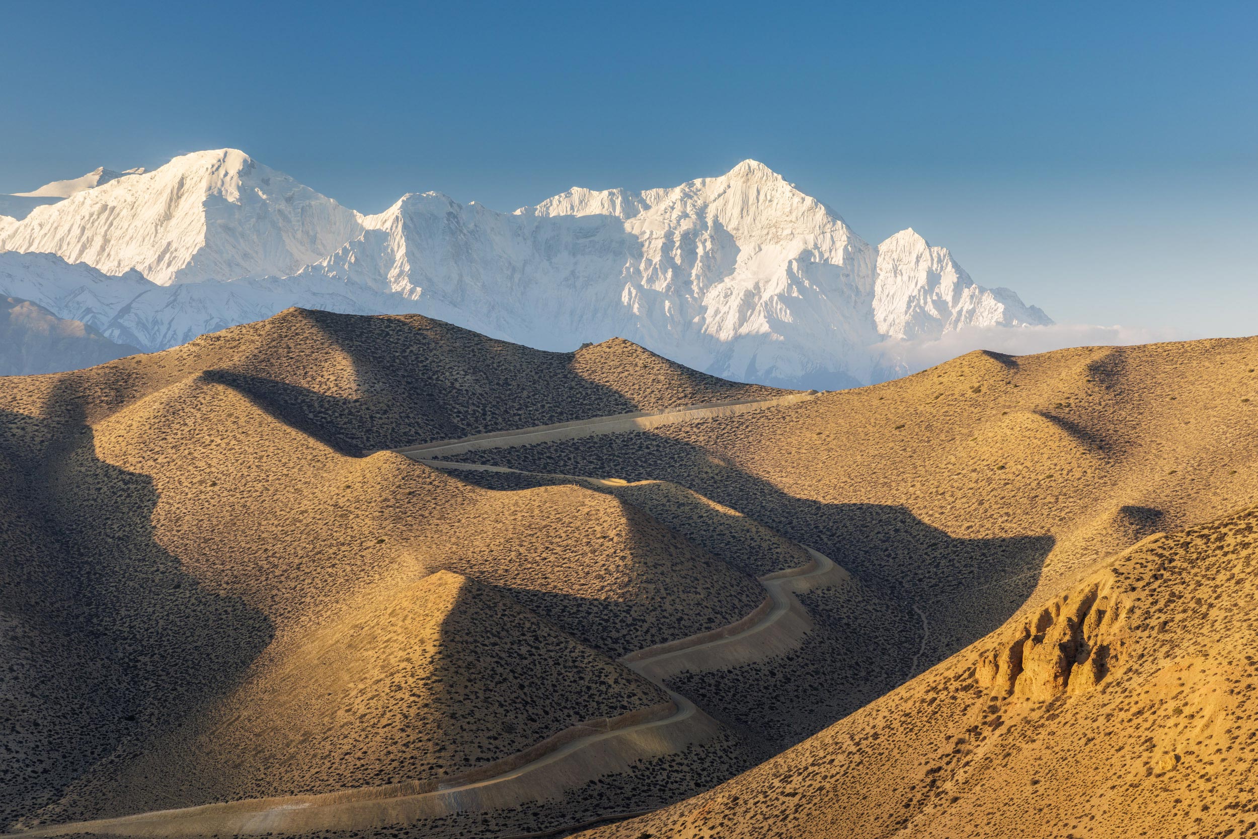 The beautiful Nilgiri looming above Upper Mustang in Nepal. Taken during Nepal travel photography tour and workshop.