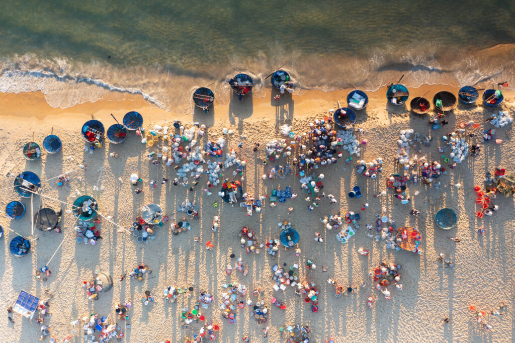 Aerial drone point of view of a market on a beach near to Hoi An in Quang Nam. Taken during Vietnam photo tour workshop.