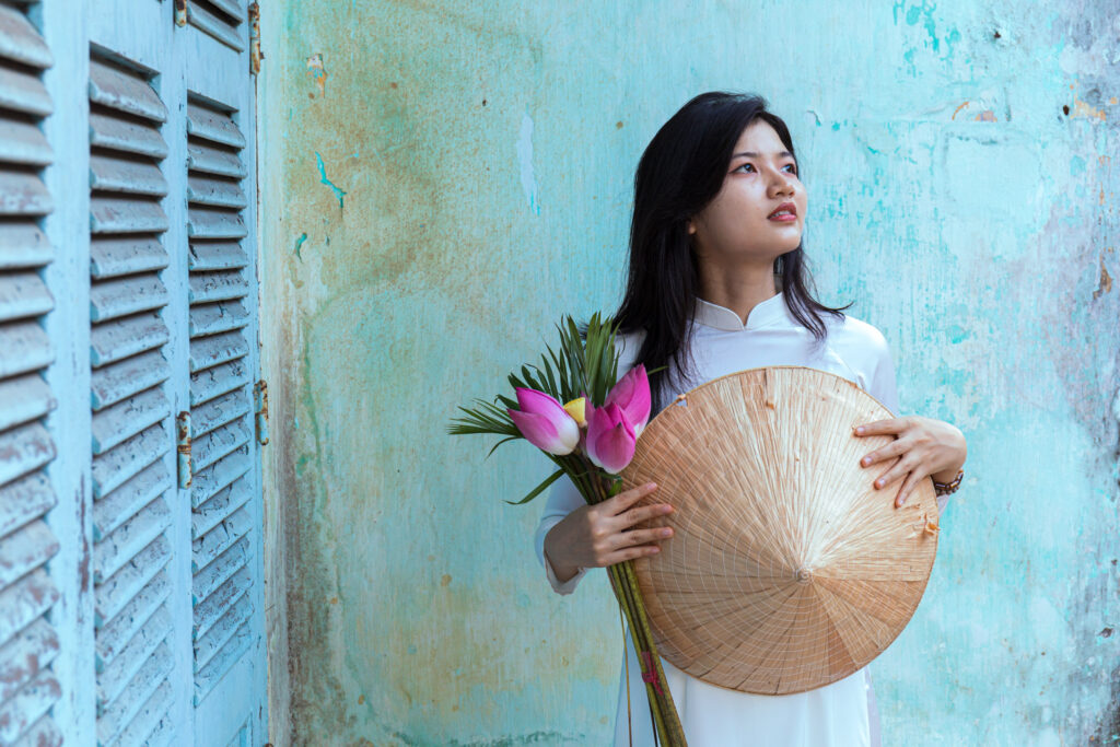 A beautiful Vietnamese woman dressed in an ao dai. Taken during Vietnam photo tour workshop.
