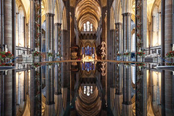 The nave reflecting in the font of Salisbury cathedral, UK.
