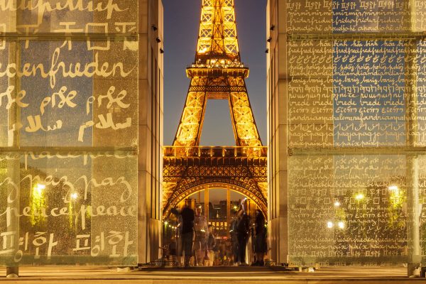 The Eiffel Tower and Mur Pour La Paix at night, Paris.