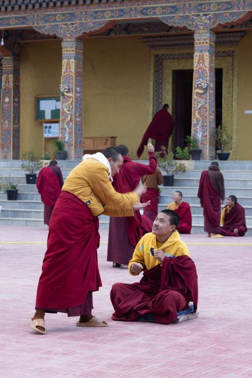 Monks debating the scriptures in Gangtey Buddhist College, Bhutan.