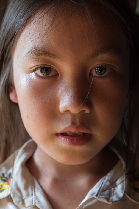 Portrait of a young Hmong girl in northern Vietnam. Portrait of a young Hmong girl in northern Vietnam.